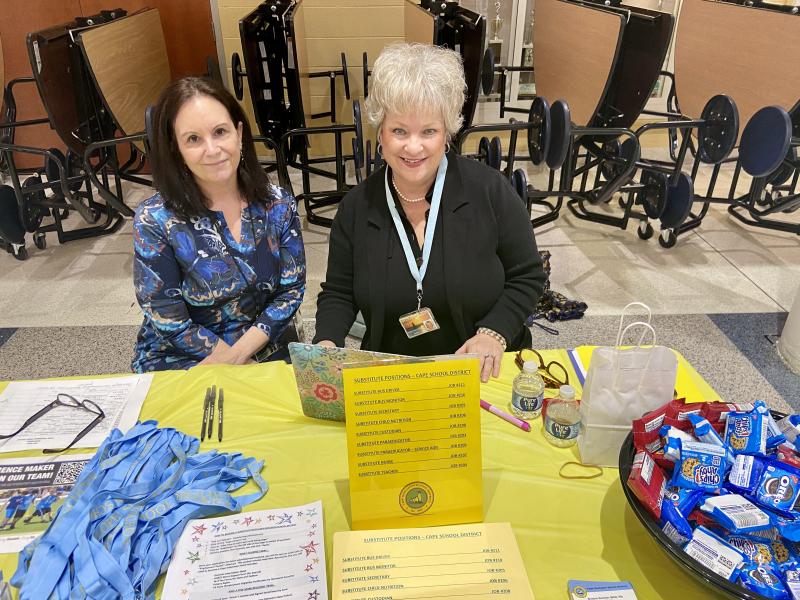 Senior Secretary Michelle Esposito, left, and Lead Nurse Bobbie Redefer provide information about substitute positions in a variety of fields.